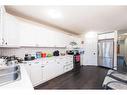 55 Falchurch Road Ne, Calgary, AB  - Indoor Photo Showing Kitchen With Double Sink 