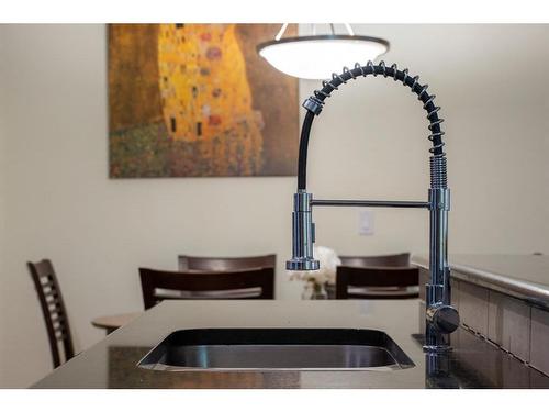 104-41 6A Street Ne, Calgary, AB - Indoor Photo Showing Kitchen With Double Sink