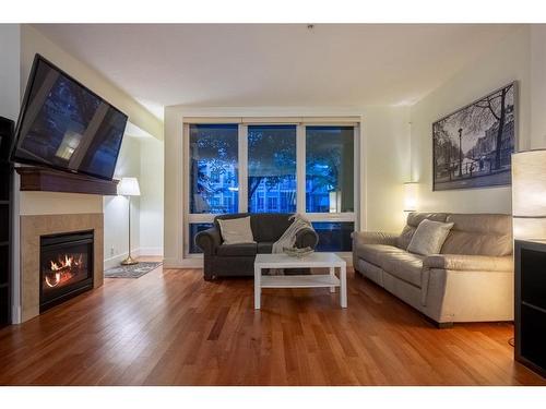 104-41 6A Street Ne, Calgary, AB - Indoor Photo Showing Living Room With Fireplace