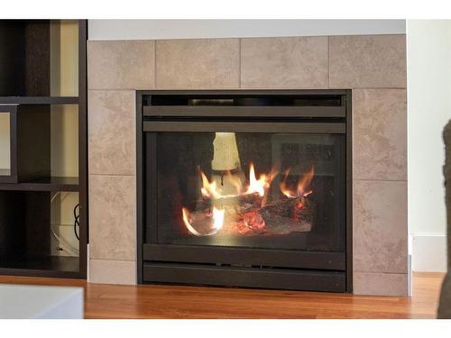 104-41 6A Street Ne, Calgary, AB - Indoor Photo Showing Living Room With Fireplace