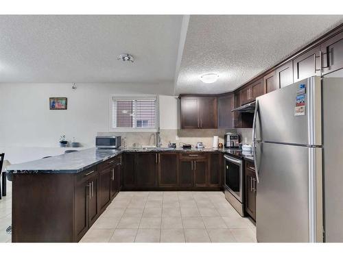 22 Taralake Cape Ne, Calgary, AB - Indoor Photo Showing Kitchen With Double Sink