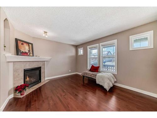 179 Silverado Drive Sw, Calgary, AB - Indoor With Fireplace