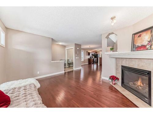 179 Silverado Drive Sw, Calgary, AB - Indoor Photo Showing Living Room With Fireplace