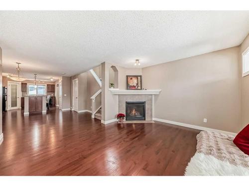 179 Silverado Drive Sw, Calgary, AB - Indoor Photo Showing Living Room With Fireplace