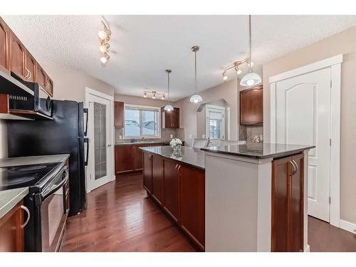 179 Silverado Drive Sw, Calgary, AB - Indoor Photo Showing Kitchen With Upgraded Kitchen