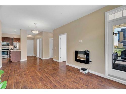 311-22 Auburn Bay Link Se, Calgary, AB - Indoor With Fireplace