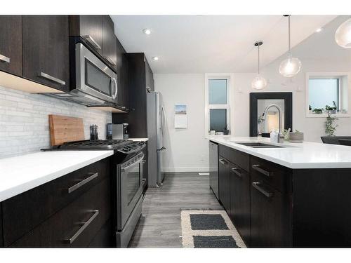 1-3716 16 Street Sw, Calgary, AB - Indoor Photo Showing Kitchen With Double Sink With Upgraded Kitchen