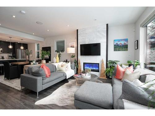 1-3716 16 Street Sw, Calgary, AB - Indoor Photo Showing Living Room With Fireplace