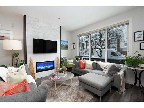 1-3716 16 Street Sw, Calgary, AB - Indoor Photo Showing Living Room With Fireplace