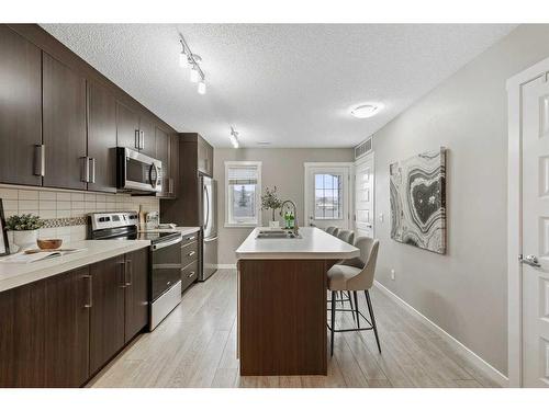 310 Mckenzie Towne Close Se, Calgary, AB - Indoor Photo Showing Kitchen With Upgraded Kitchen