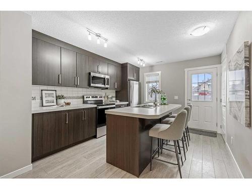 310 Mckenzie Towne Close Se, Calgary, AB - Indoor Photo Showing Kitchen With Double Sink