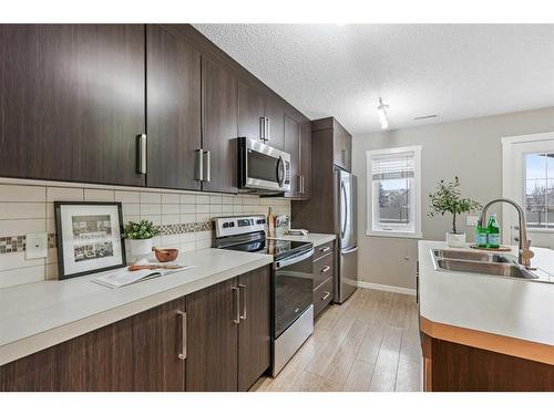 310 Mckenzie Towne Close Se, Calgary, AB - Indoor Photo Showing Kitchen With Double Sink With Upgraded Kitchen