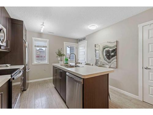 310 Mckenzie Towne Close Se, Calgary, AB - Indoor Photo Showing Kitchen With Double Sink With Upgraded Kitchen