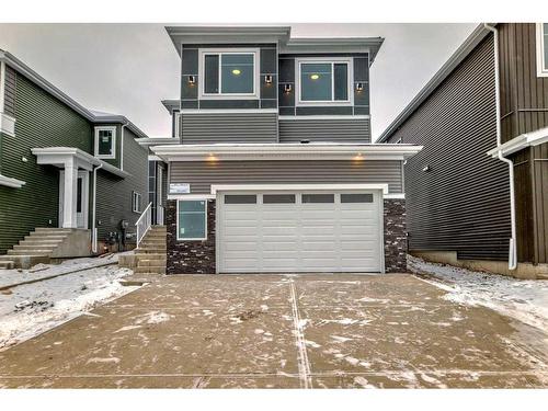 492 Rivercrest View, Cochrane, AB - Outdoor With Facade