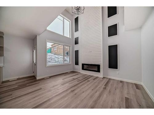 492 Rivercrest View, Cochrane, AB - Indoor With Fireplace