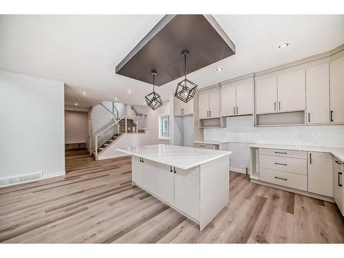 492 Rivercrest View, Cochrane, AB - Indoor Photo Showing Kitchen With Upgraded Kitchen