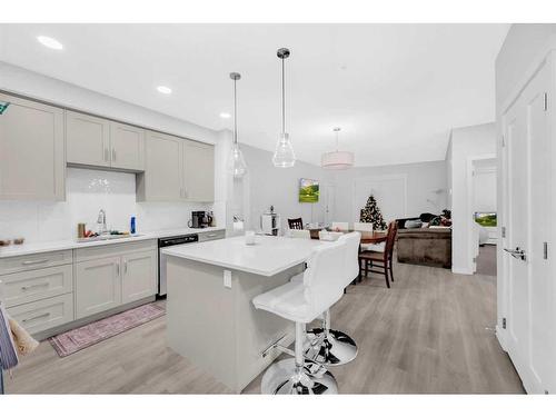 305-150 Shawnee Square Sw, Calgary, AB - Indoor Photo Showing Kitchen With Upgraded Kitchen