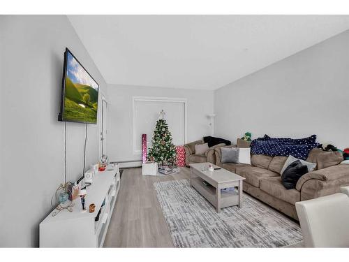 305-150 Shawnee Square Sw, Calgary, AB - Indoor Photo Showing Living Room