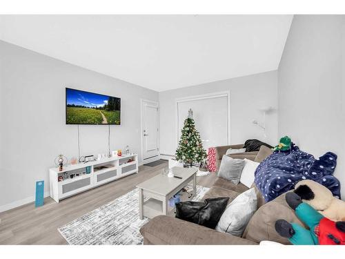 305-150 Shawnee Square Sw, Calgary, AB - Indoor Photo Showing Living Room