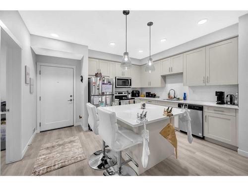 305-150 Shawnee Square Sw, Calgary, AB - Indoor Photo Showing Kitchen With Upgraded Kitchen