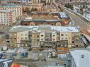 305-150 Shawnee Square Sw, Calgary, AB  - Outdoor With Balcony With View 