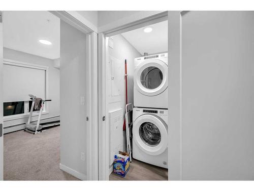 305-150 Shawnee Square Sw, Calgary, AB - Indoor Photo Showing Laundry Room