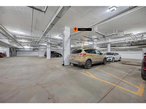 305-150 Shawnee Square Sw, Calgary, AB - Indoor Photo Showing Garage