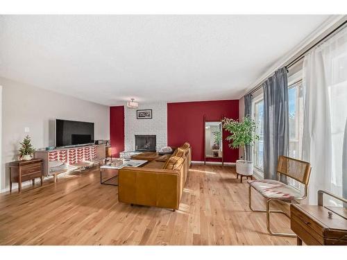 8316 46 Avenue Nw, Calgary, AB - Indoor Photo Showing Living Room With Fireplace