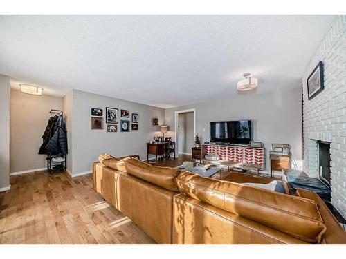 8316 46 Avenue Nw, Calgary, AB - Indoor Photo Showing Living Room With Fireplace