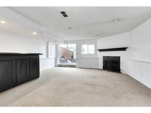 80 Rivercrest Crescent Se, Calgary, AB - Indoor With Fireplace