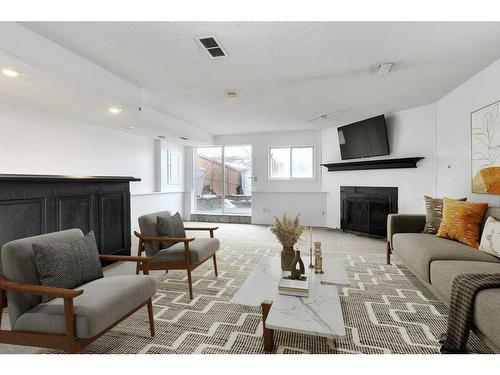 80 Rivercrest Crescent Se, Calgary, AB - Indoor Photo Showing Living Room With Fireplace