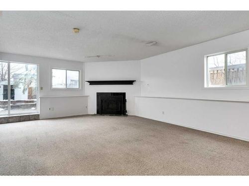 80 Rivercrest Crescent Se, Calgary, AB - Indoor Photo Showing Living Room With Fireplace