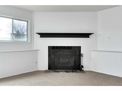 80 Rivercrest Crescent Se, Calgary, AB - Indoor With Fireplace