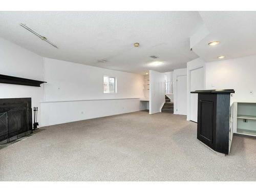 80 Rivercrest Crescent Se, Calgary, AB - Indoor With Fireplace