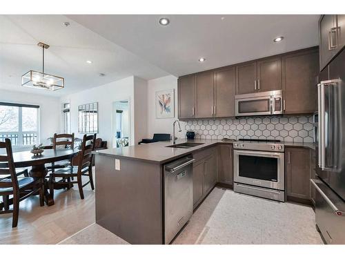 108-145 Burma Star Road Sw, Calgary, AB - Indoor Photo Showing Kitchen With Double Sink With Upgraded Kitchen