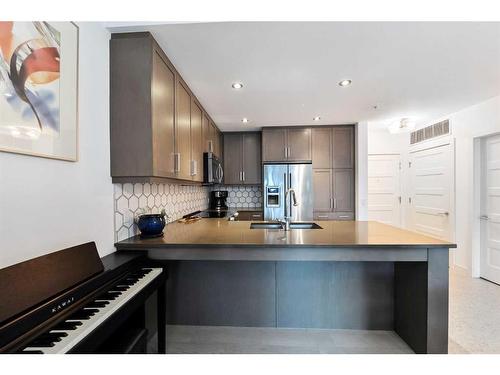 108-145 Burma Star Road Sw, Calgary, AB - Indoor Photo Showing Kitchen With Upgraded Kitchen