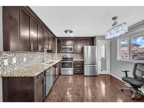 44-1515 Falconridge Drive Ne, Calgary, AB - Indoor Photo Showing Kitchen With Double Sink With Upgraded Kitchen