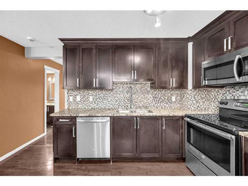 44-1515 Falconridge Drive Ne, Calgary, AB - Indoor Photo Showing Kitchen With Double Sink With Upgraded Kitchen