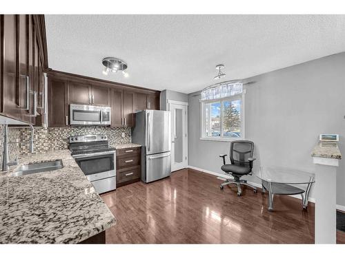 44-1515 Falconridge Drive Ne, Calgary, AB - Indoor Photo Showing Kitchen With Double Sink