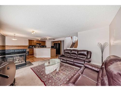 45 Everhollow Park Sw, Calgary, AB - Indoor Photo Showing Living Room With Fireplace