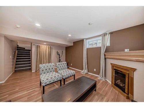 45 Everhollow Park Sw, Calgary, AB - Indoor Photo Showing Living Room With Fireplace