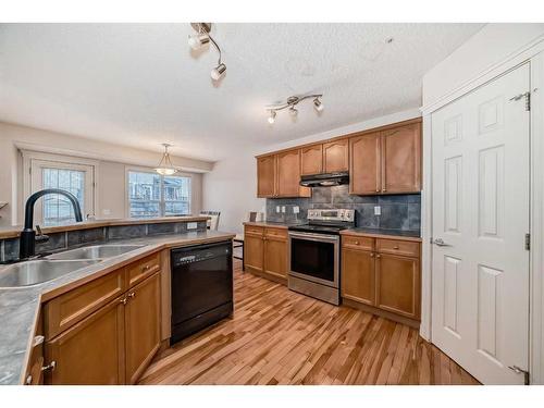 45 Everhollow Park Sw, Calgary, AB - Indoor Photo Showing Kitchen With Double Sink