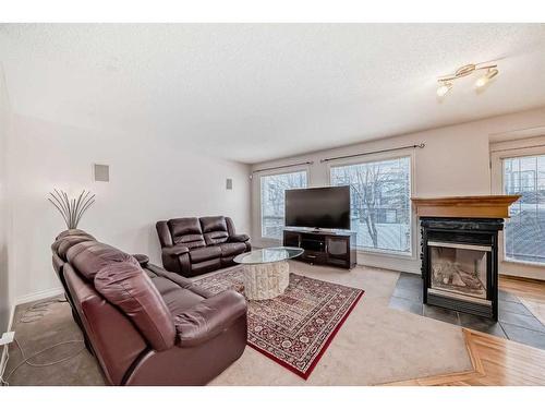 45 Everhollow Park Sw, Calgary, AB - Indoor Photo Showing Living Room With Fireplace