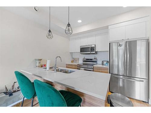 906-10060 46 Street Ne, Calgary, AB - Indoor Photo Showing Kitchen With Stainless Steel Kitchen With Double Sink With Upgraded Kitchen