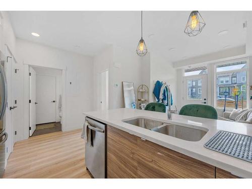 906-10060 46 Street Ne, Calgary, AB - Indoor Photo Showing Kitchen With Double Sink