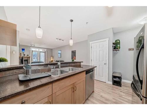 301-4 Hemlock Crescent Sw, Calgary, AB - Indoor Photo Showing Kitchen With Double Sink