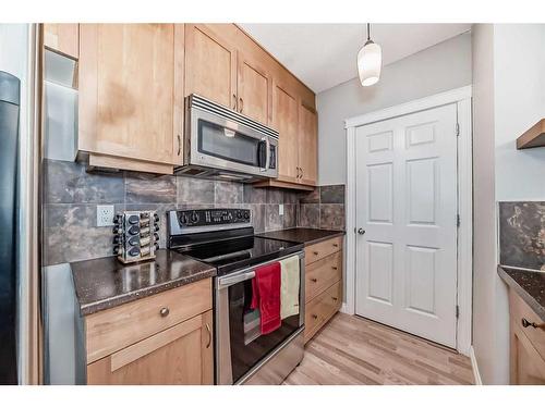 301-4 Hemlock Crescent Sw, Calgary, AB - Indoor Photo Showing Kitchen With Stainless Steel Kitchen