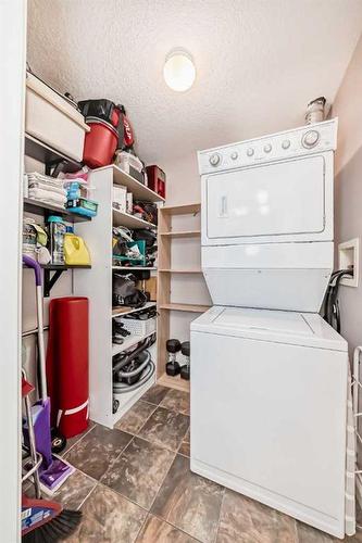 301-4 Hemlock Crescent Sw, Calgary, AB - Indoor Photo Showing Laundry Room