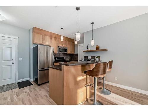 301-4 Hemlock Crescent Sw, Calgary, AB - Indoor Photo Showing Kitchen With Stainless Steel Kitchen