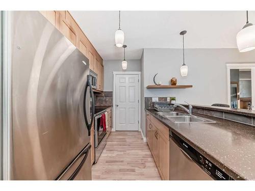 301-4 Hemlock Crescent Sw, Calgary, AB - Indoor Photo Showing Kitchen With Stainless Steel Kitchen With Double Sink